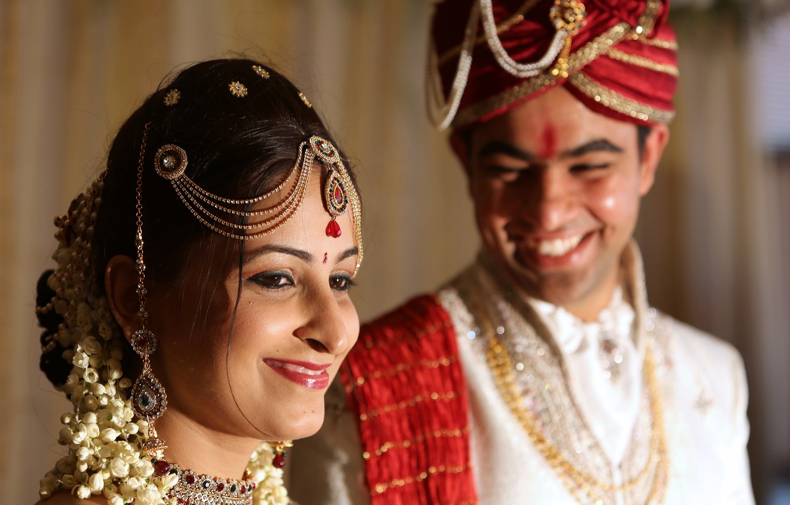 Candid wedding photography of a happy couple sharing a natural moment